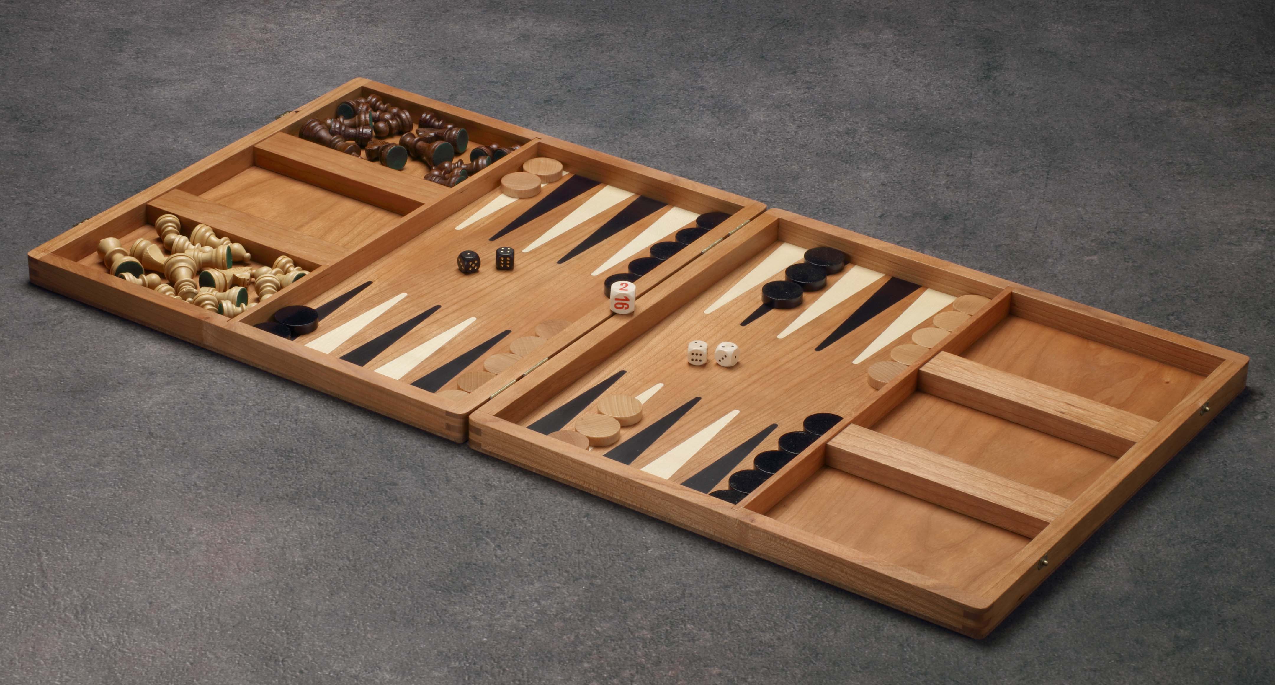 Large cherry wood game collection with chess, checkers, mill, and backgammon